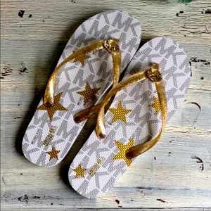 Michael Kors “jet set” glitter flip flops